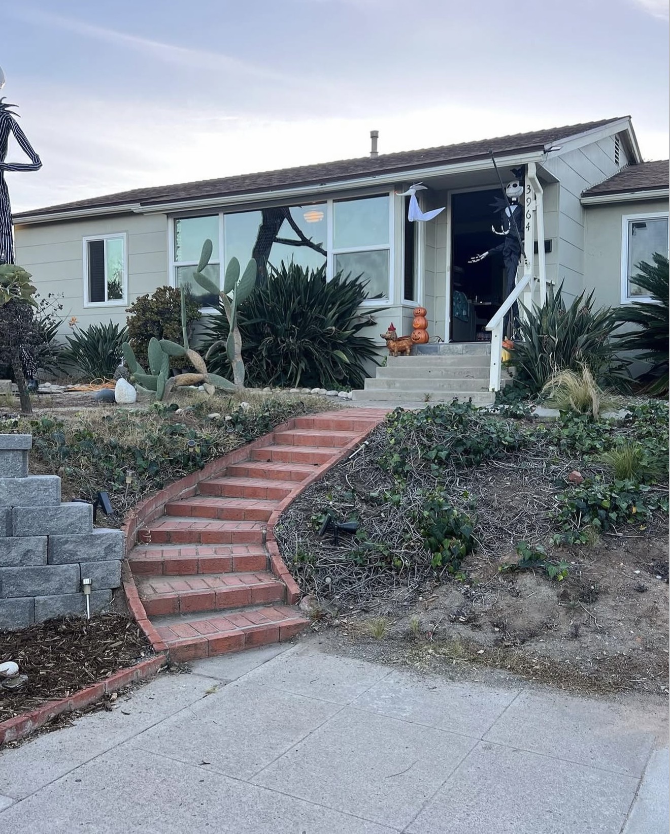 Gray Block Retaining Wall & Brick Stairs — before state