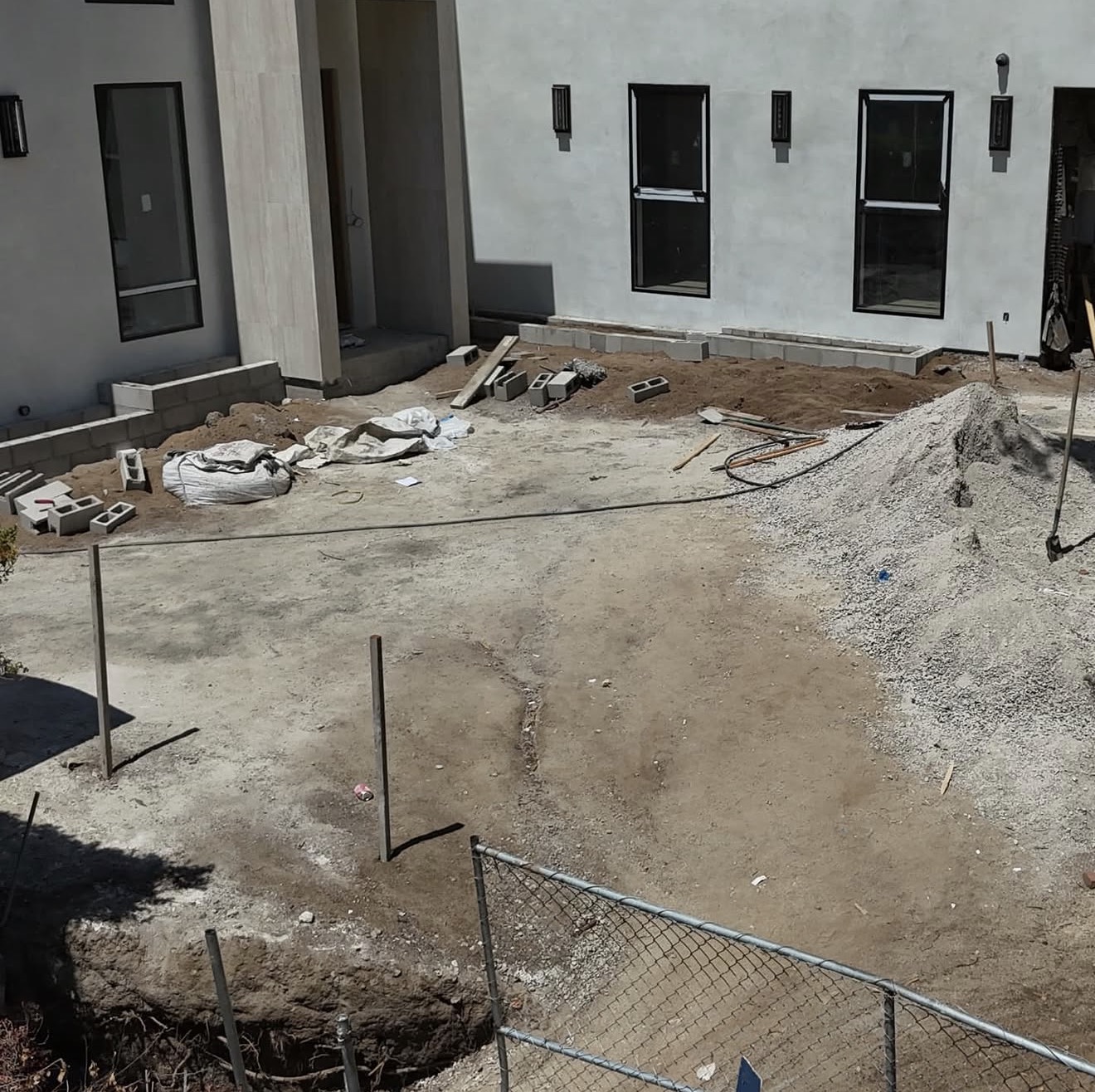 Modern Concrete Pavers & Steel Gate Entry — before state