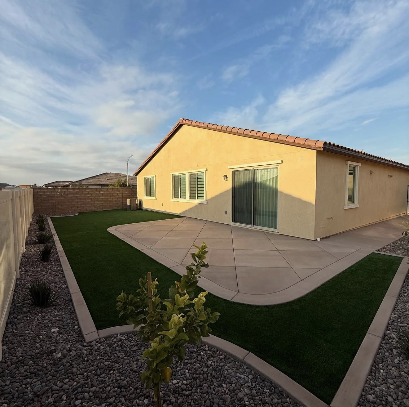 Wraparound Concrete Pad & Turf Borders — completed project