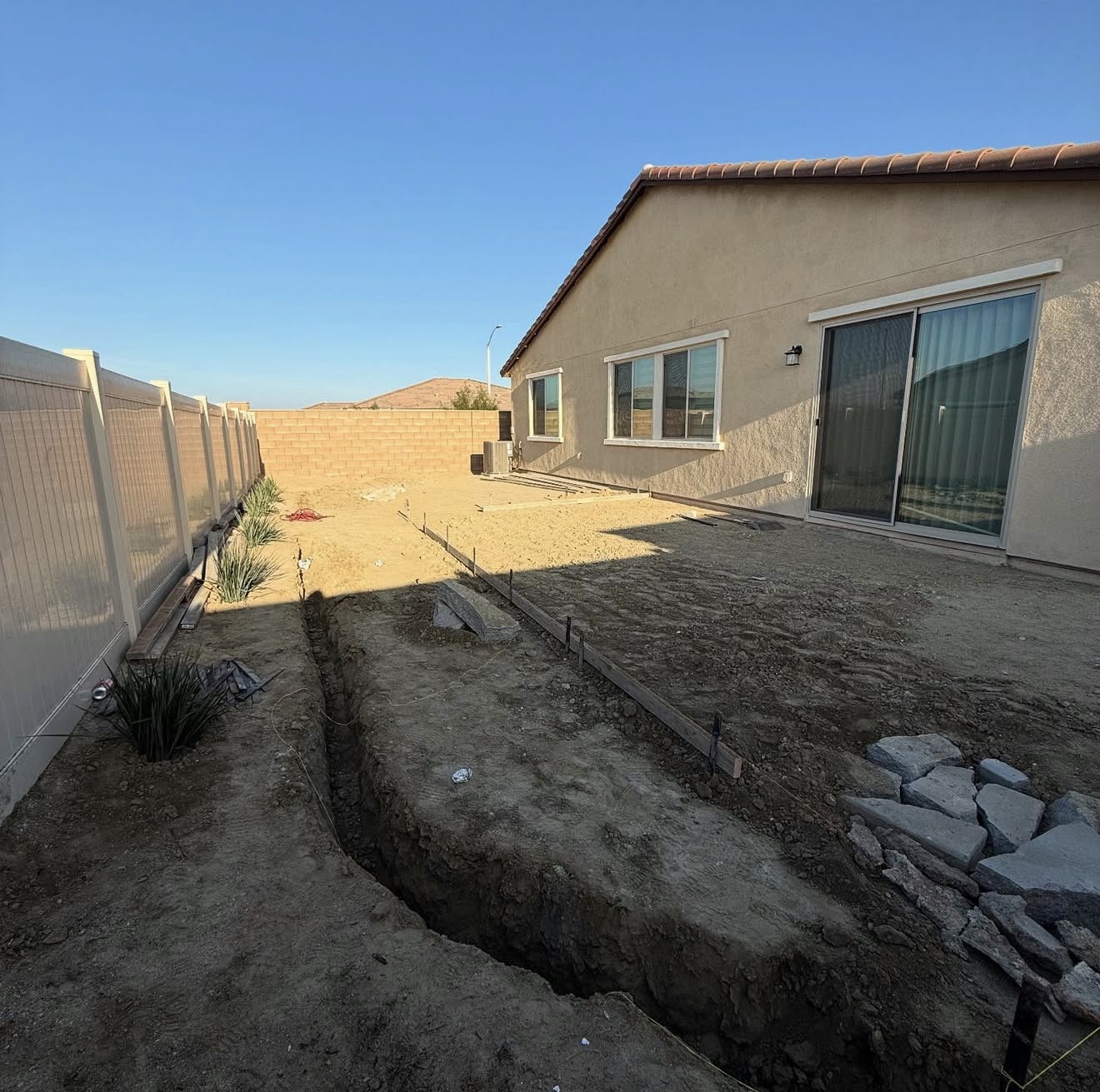 Wraparound Concrete Pad & Turf Borders — before state