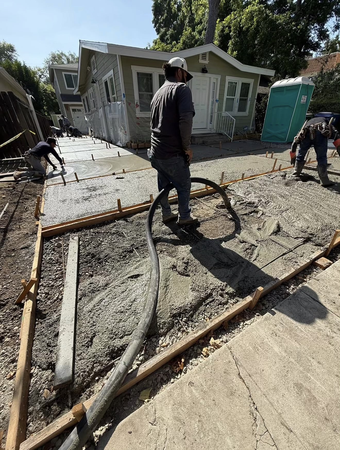 Concrete Driveway with Turf Inlay Strips — before state