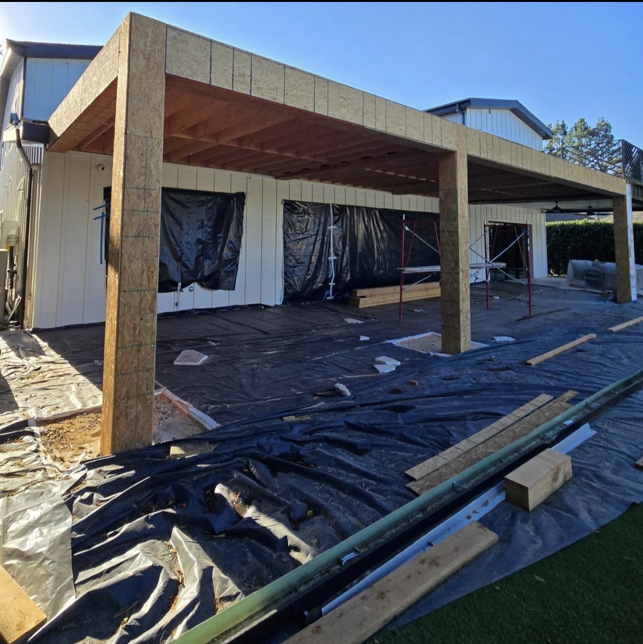 Black Steel Pergola Over Concrete Patio — before state
