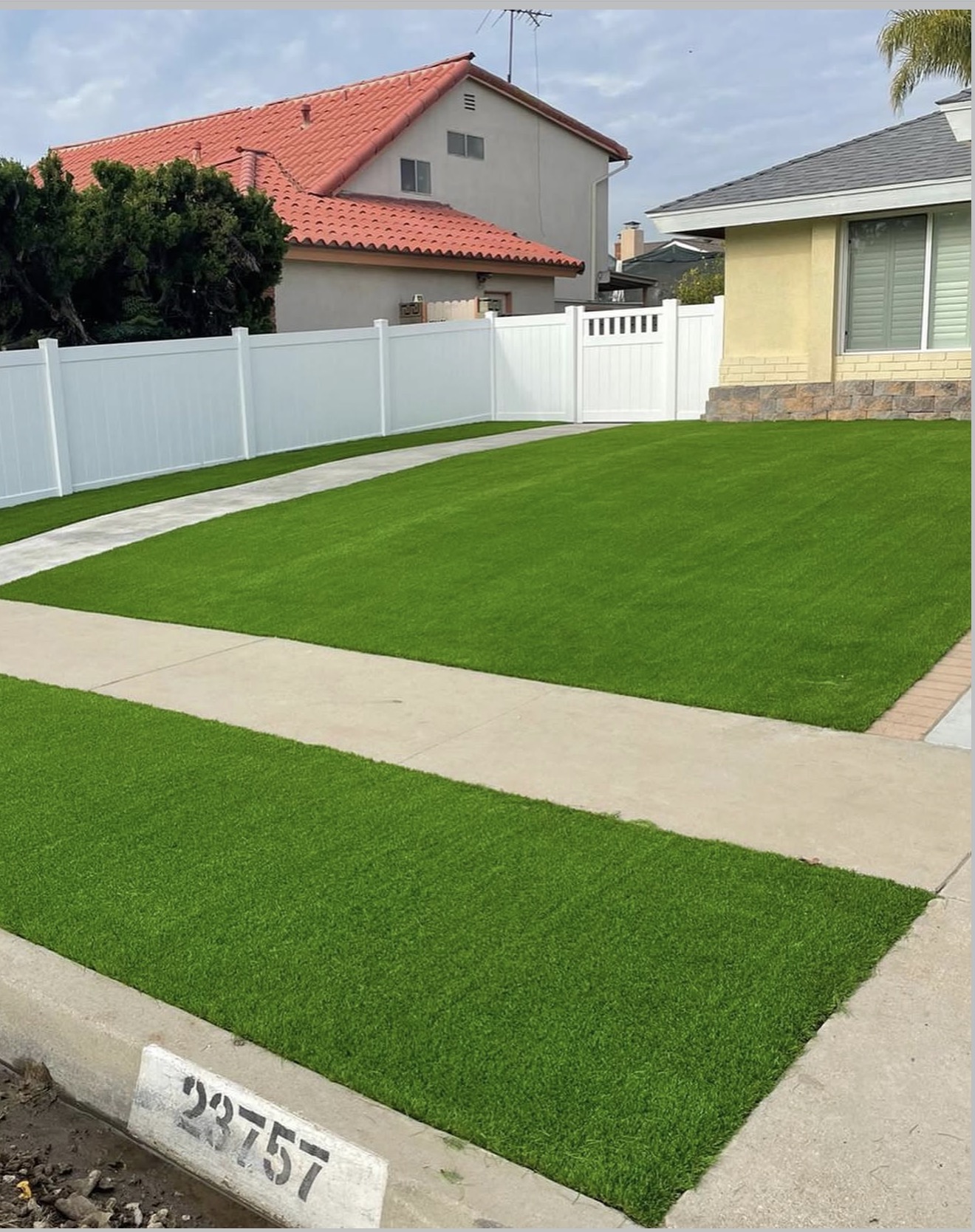 White Vinyl Privacy Fence & Front Turf — completed project