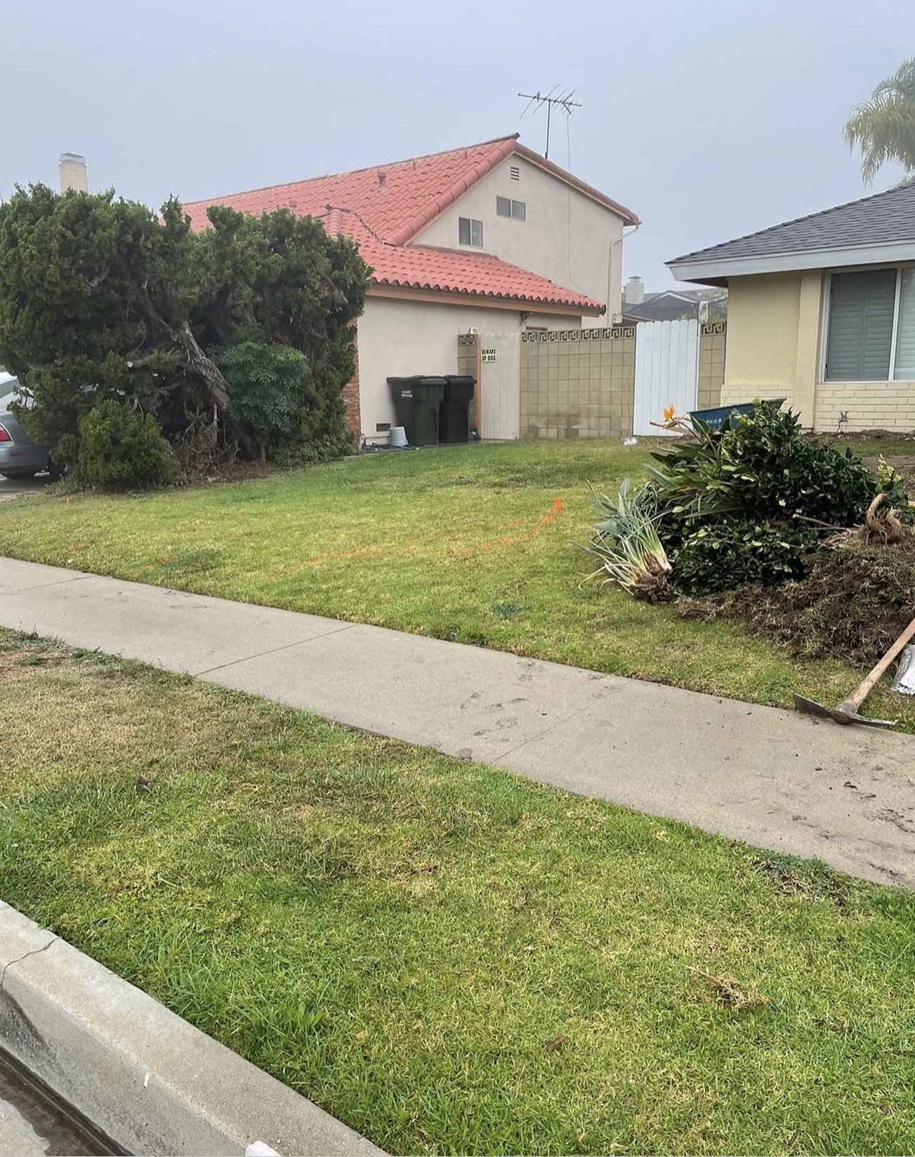White Vinyl Privacy Fence & Front Turf — before state